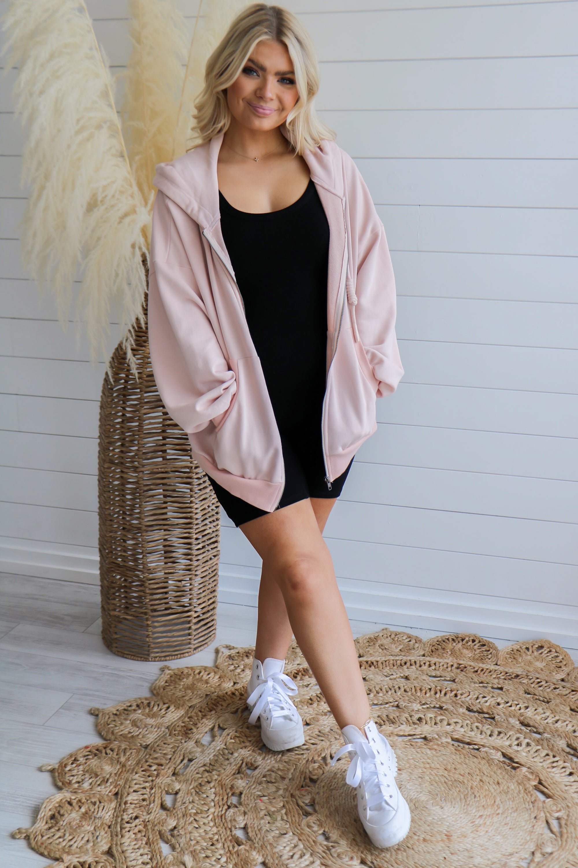 Taking Off Jacket in Blush